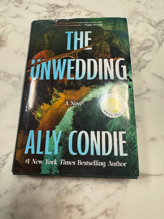 The Unwedding hardcover book by Ally Condie with coastal landscape cover and Reese's Book Club sticker