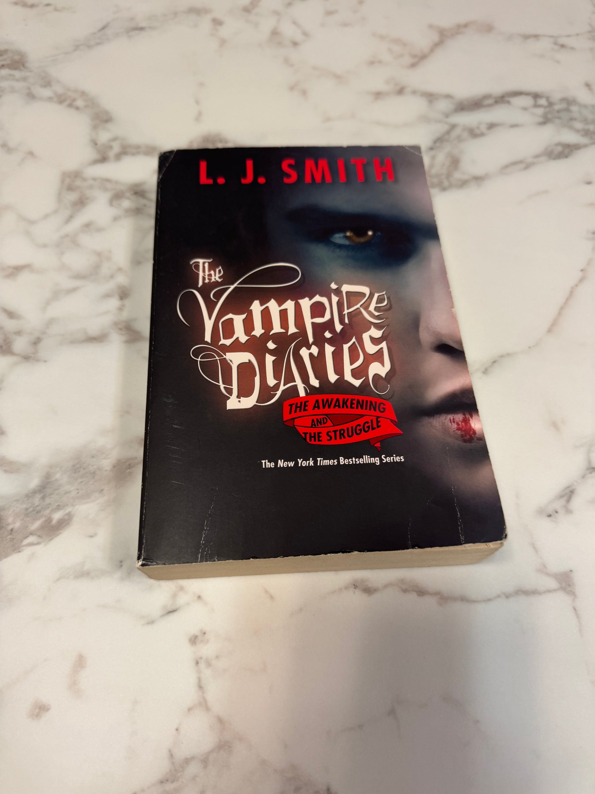 The Awakening and the Struggle paperback book by L.J. Smith with dramatic cover art