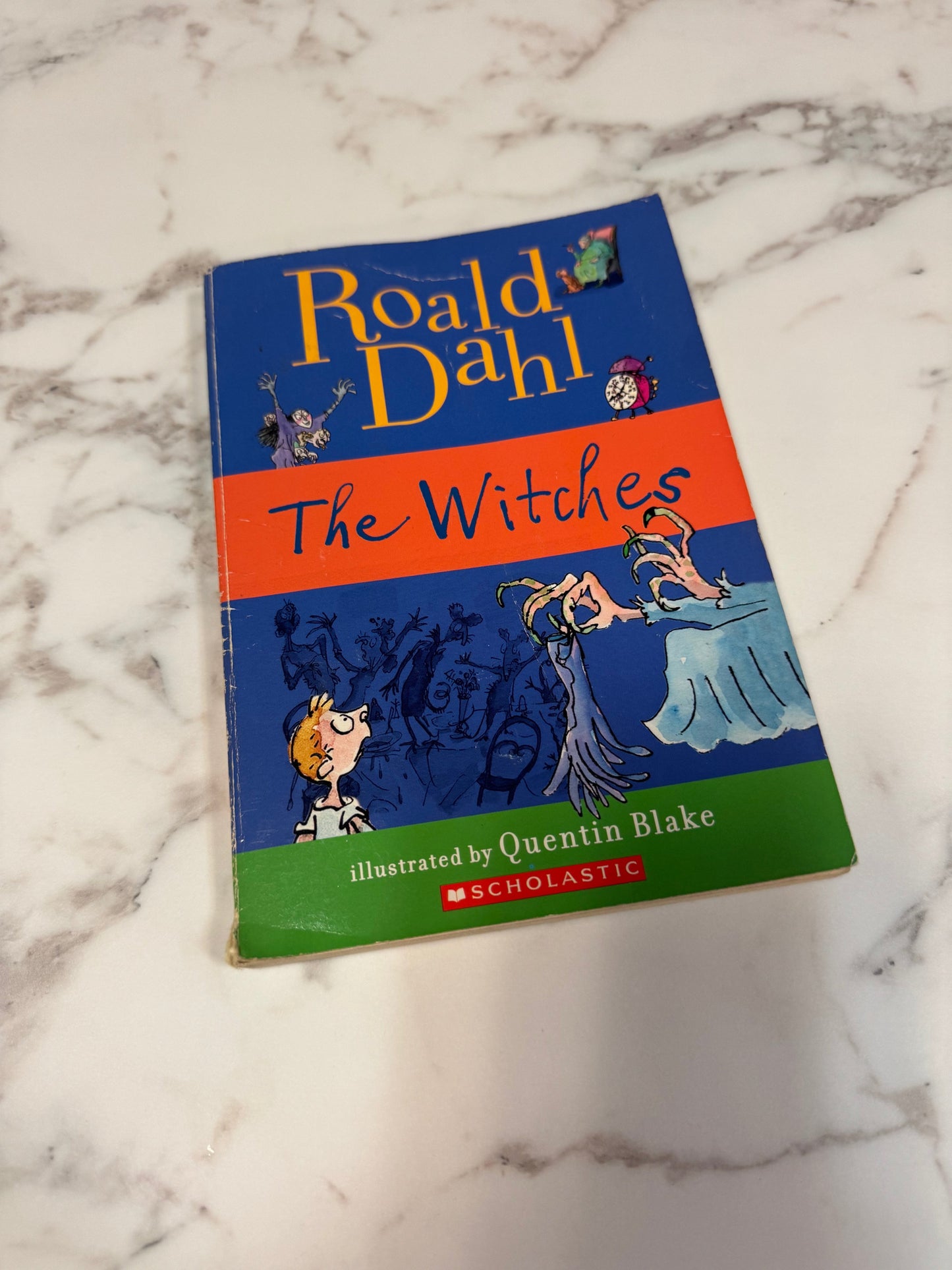 The Witches softcover book by Roald Dahl with Quentin Blake illustrations on blue, orange and green cover