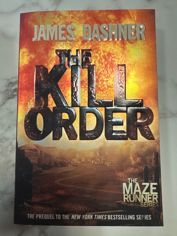 Book cover of 'The Kill Order' by James Dashner on a marble surface