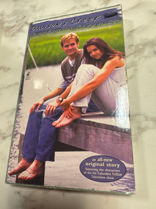 Trouble in Paradise paperback book cover featuring Dawson's Creek characters on a dock