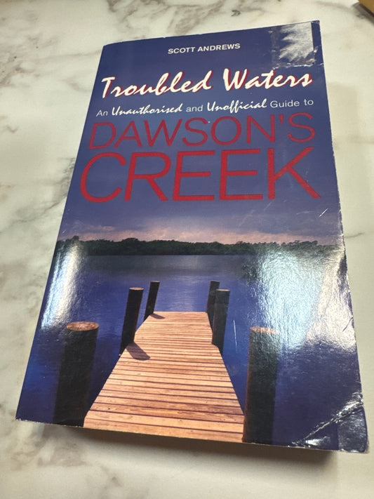 Troubled Waters paperback book by Scott Andrew featuring wooden dock cover art