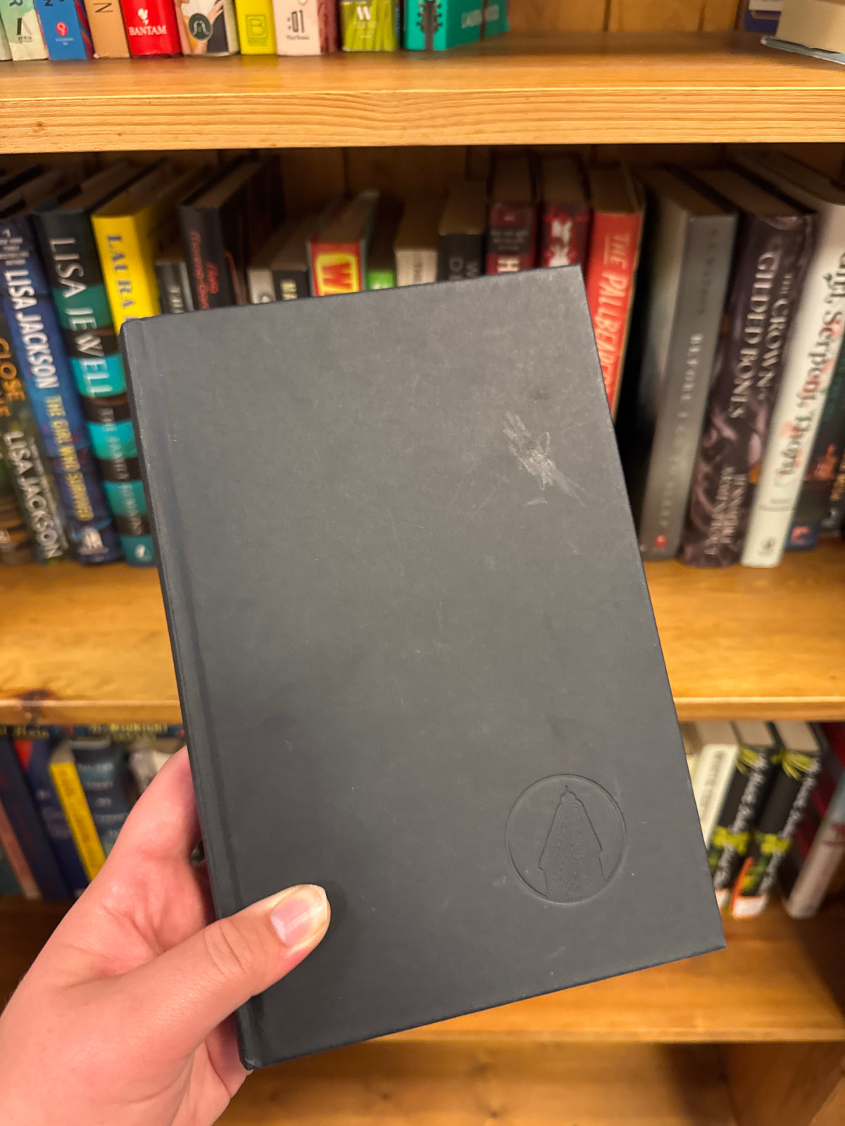 We Live Here Now matte black hardcover book by Sarah Pinborough