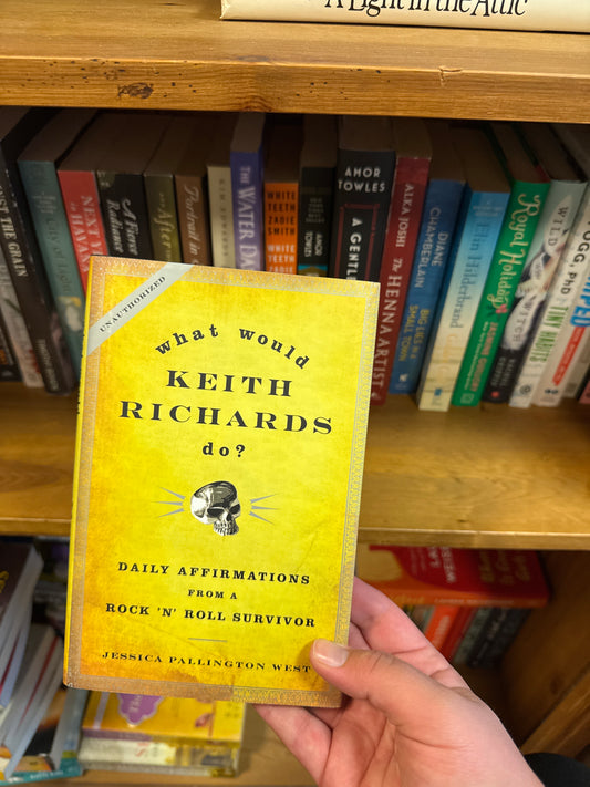 What Would Keith Richards Do? yellow paperback book with skull design by Jessica Pallington West