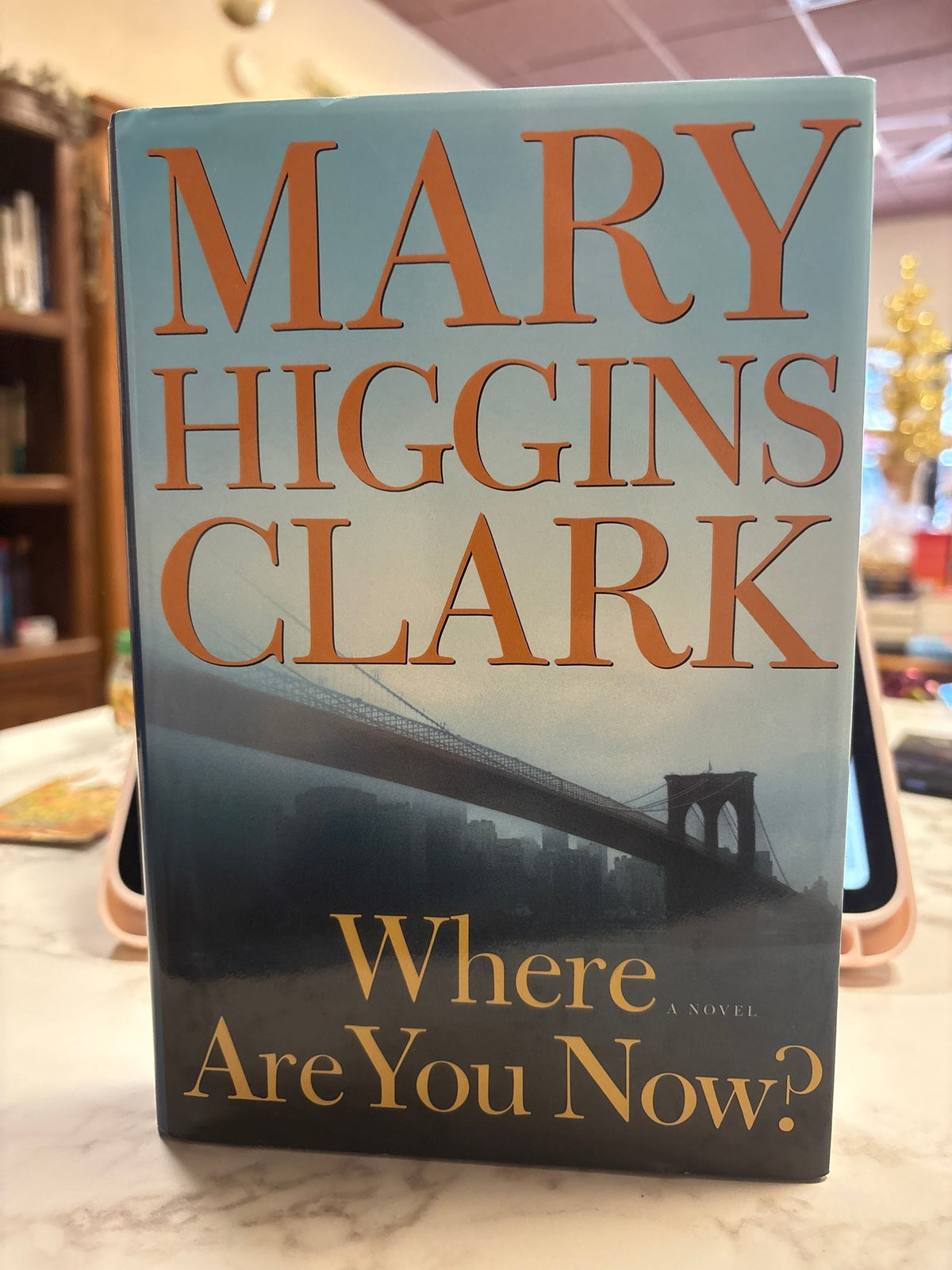 Where Are You Now? hardcover novel by Mary Higgins Clark with blue-gray cover and gold title text