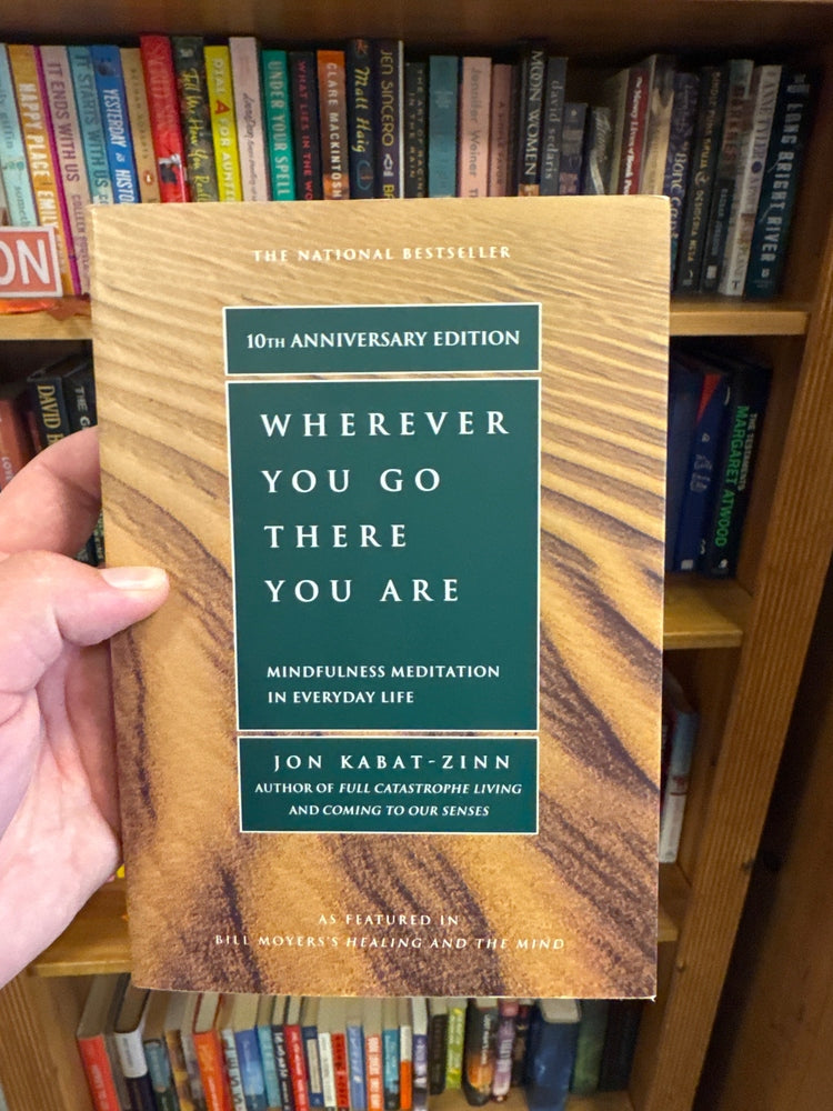 Wherever You Go There You Are 10th Anniversary Edition book with wood grain cover and teal label
