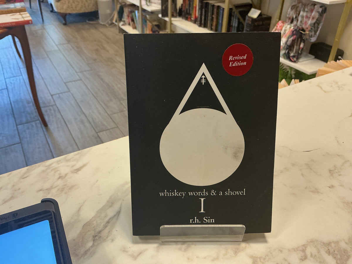 A book titled 'whiskey words & a shovel' by r.h.