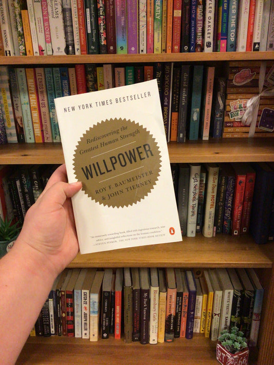Willpower paperback book by Roy Baumeister and John Tierney with gold starburst sticker