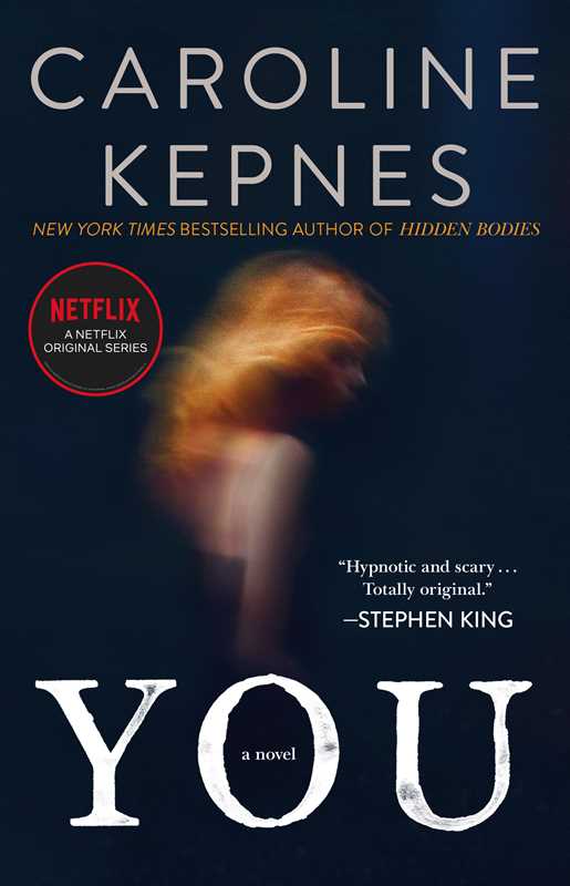 You paperback novel by Caroline Kepnes, Netflix tie-in edition with navy cover and red-haired woman